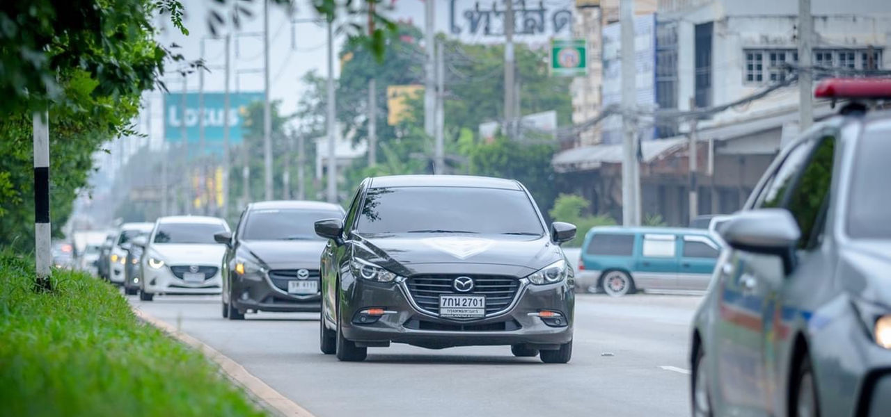 Mazda cars on road in Thailand