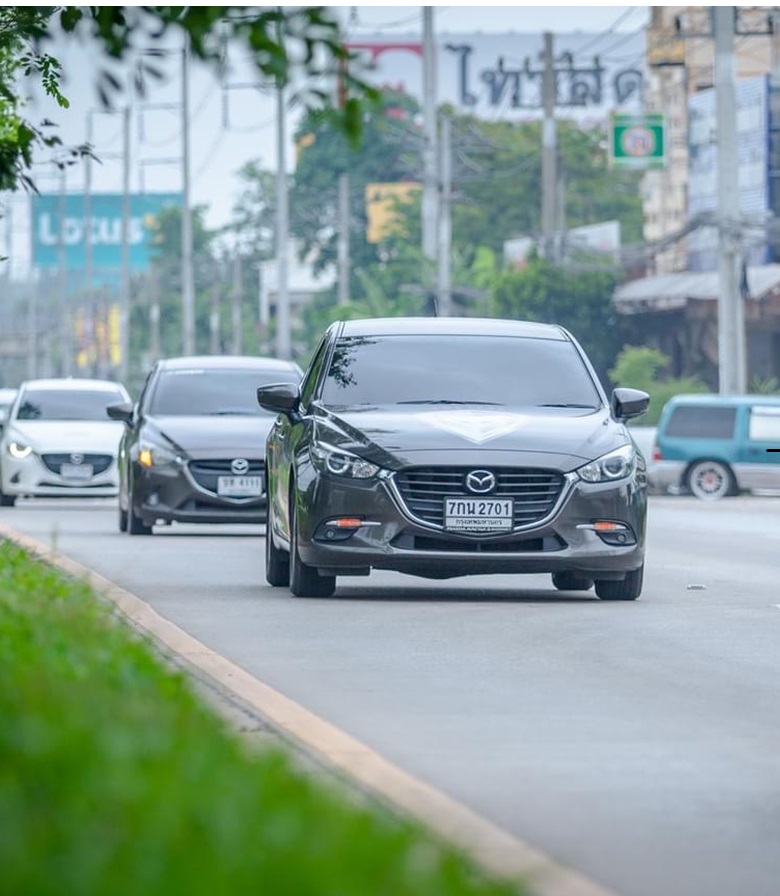 Mazda cars on road in Thailand